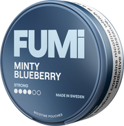 A round tin of Fumi Minty Blueberry nicotine pouches, featuring a dark blue-gray lid with bold white text and a white band around the side.