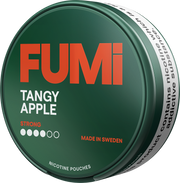 A round green tin of FUMi Tangy Apple strong nicotine pouches, featuring a dark green lid with bold orange and white text, and a white side band with black warning text.