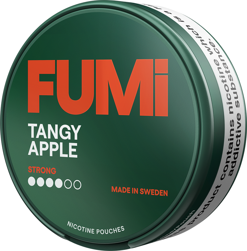 A round green tin of FUMi Tangy Apple strong nicotine pouches, featuring a dark green lid with bold orange and white text, and a white side band with black warning text.