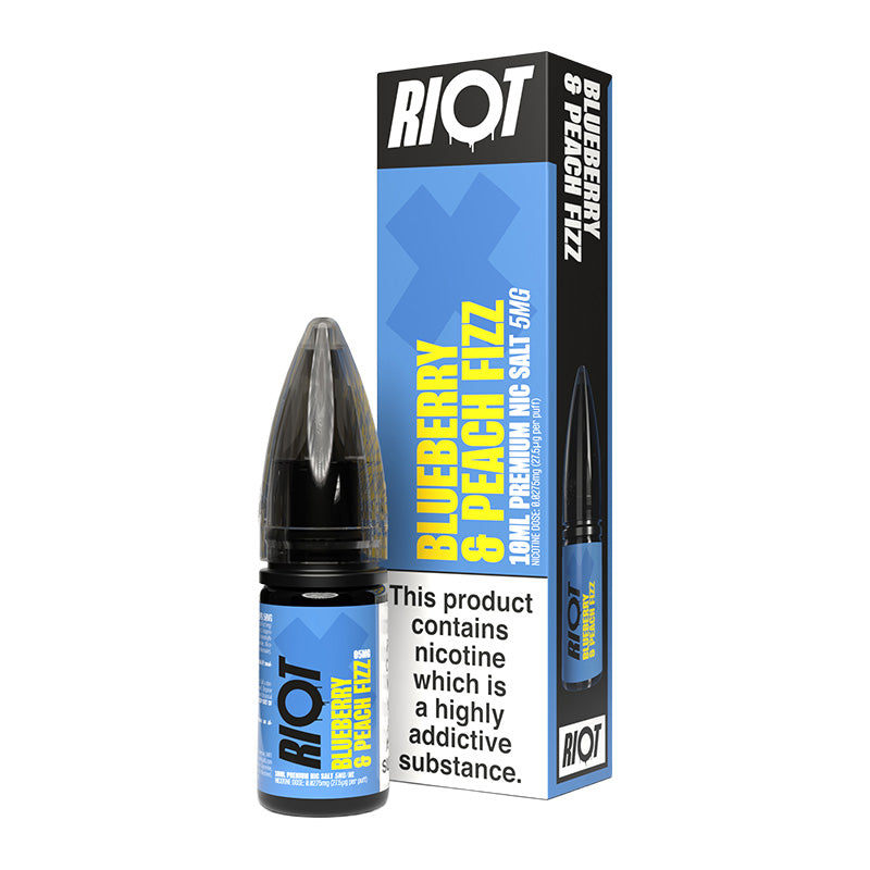 A 10ml bottle of Riot X Blueberry & Peach Fizz 5mg  e-liquid next to its retail packaging box, both featuring a blue and black design with a prominent nicotine warning label.